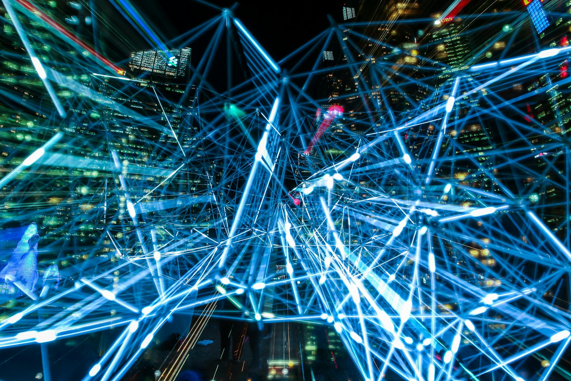 Long-exposure light trails of a city at night, seen from above
